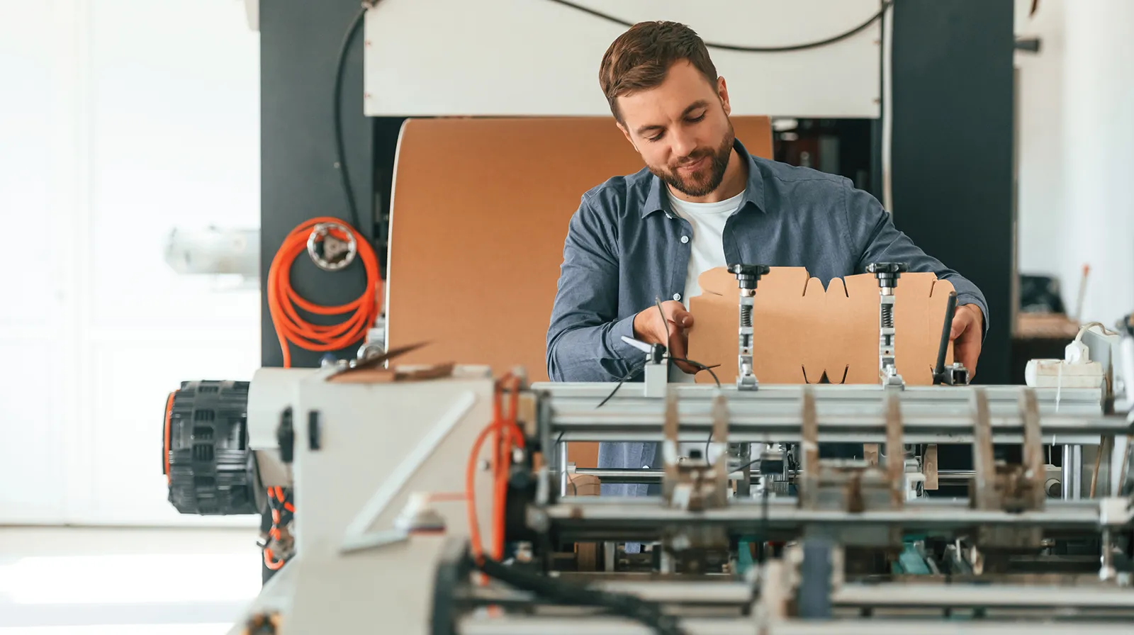 Overhead view of packaging dielines arranged on a printing sheet showing optimal imposition for cartons and labels to minimize waste